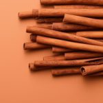 minimal-style-cinnamon-sticks-brown-background-ai-generated_804788-36324