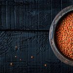 plate-lentils-wooden-table-seen-from-minimalistic-photo-with-copy-space_890746-146633
